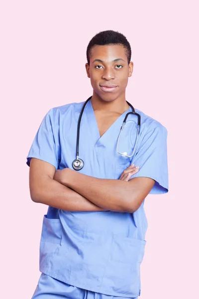 Portrait Mixed Race Male Surgeon Arms Crossed Pink Background — Stock Photo, Image