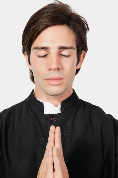 Young Man Priest Costume Praying Gray Background — Stock Photo, Image