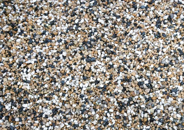 背景上的不同鹅卵石的混合物 — 图库照片