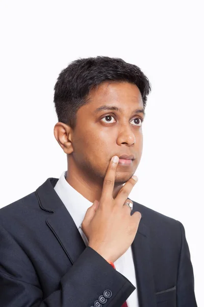 Contemplative Young Asian Businessman Hand Chin White Background — Stock Photo, Image