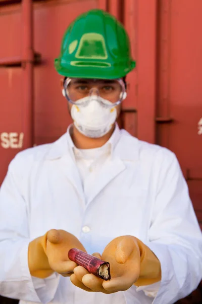 Safety inspector holding explosive material