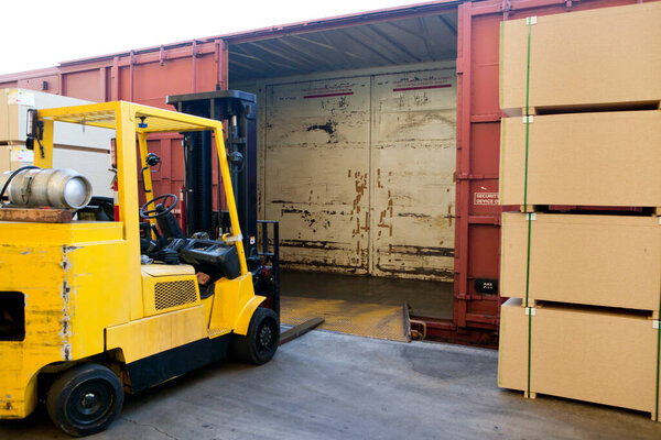 Fork Lift Truck loading industrial railway carriage