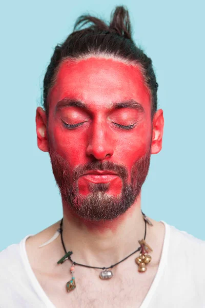 Portrait Young Man Eyes Closed Red Painted Face Blue Background — Stock Photo, Image