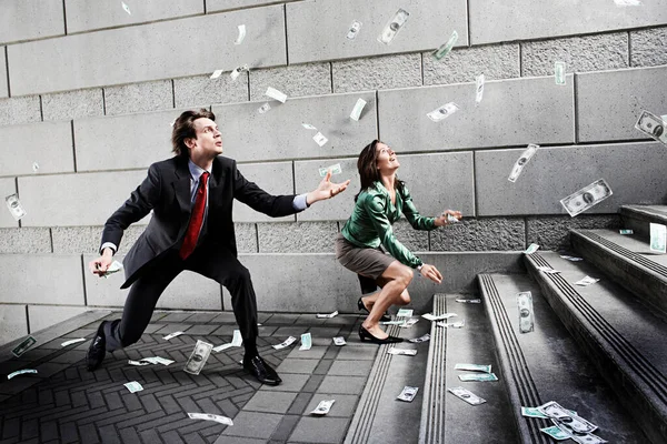 Businessman Woman Catching Falling Money Steps — Stock Photo, Image