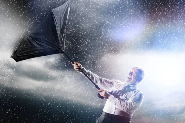 Geschäftsmann Verliert Kontrolle Über Regenschirm Von Innen Heraus — Stockfoto