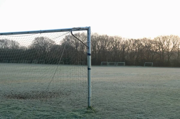 Goal post on empty soccer field