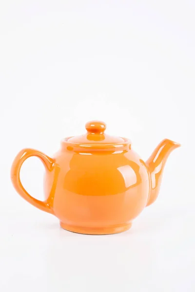 Narancs Tea Fazék Háttérben Közelről — Stock Fotó
