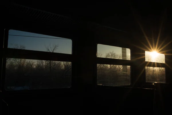 Windows in the train reminiscent of film, each window-a separate frame with its own story