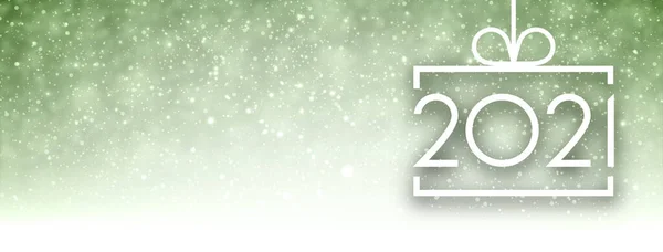 白色正方形圣诞树玩具轮廓 2021年标志挂在缎带上 闪烁着绿色的背景 灯火通明 给你的文字一些空间 病媒假日图解 — 图库矢量图片