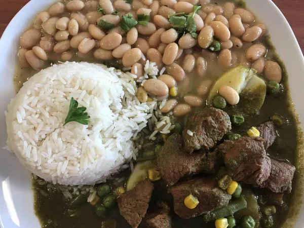 Latin Food Dish - Pinto beans rice and beef - Photo