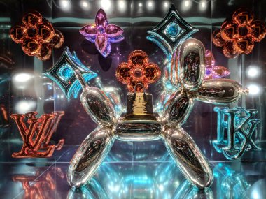 Waikiki - December 7, 2017: Balloon dog with handbag on top - Louis Vuitton x Jeff Koons - The Masters collection window Display.  Louis Vuitton Malletier, commonly referred to as Louis Vuitton, or shortened to LV, is a fashion house and luxury retai clipart