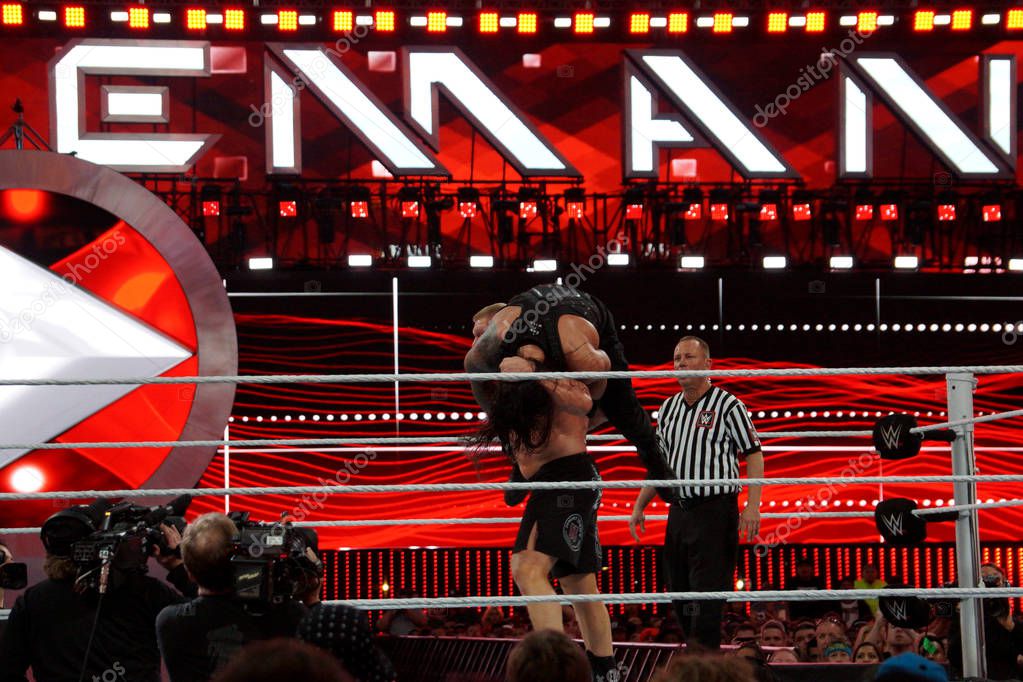 SANTA CLARA - March 29, 2015: WWE Champion Brock Lesner sets up to F-5i Roman Reigns off the top of his shoulders at Wrestlemania 31 at the Levi's Stadium in Santa Clara, California on March 29, 2015.