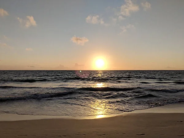 Early Morning Sunrise on Waimanalo Beach on Oahu, Hawaii over ocean.