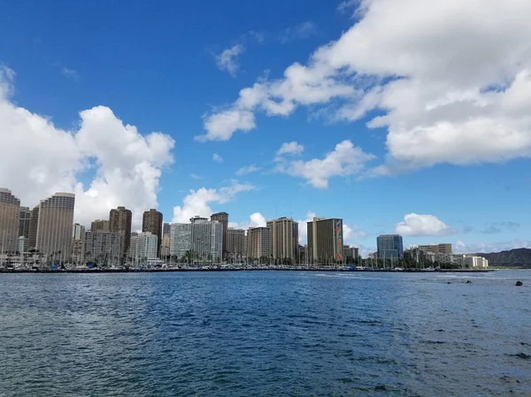 Skyline of Waikiki and Diamond Head during day with yachts and boats in Ala Moana harbor, Hotels, Crane, and Hilton Hawaiian Village framing Diamond Head in Waikiki, Oahu, Hawaii.  2017