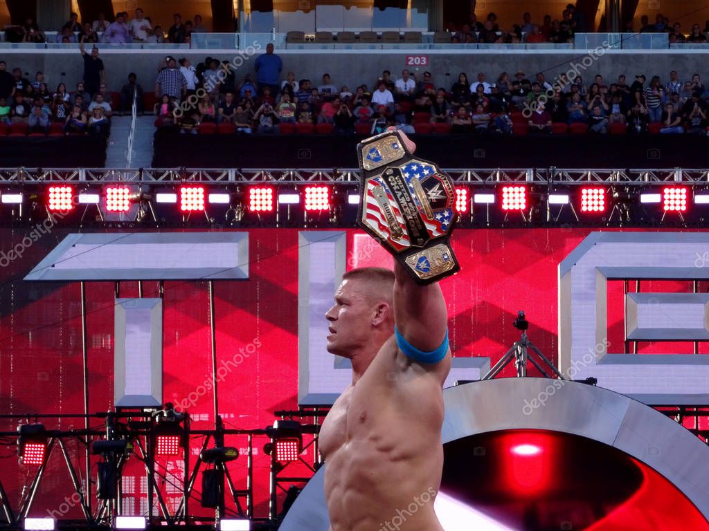 SANTA CLARA - MARCH 29: WWE Wrestler John Cena holds up USA Championship title after winning match at Wrestlemania 31 at the Levi's Stadium in Santa Clara, California on March 29, 2015.