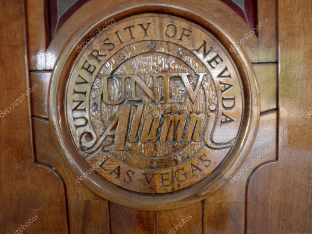 Las Vegas -  February 5, 2010:  University of Nevada, Las Vegas UNLV Alumni emblem on wood door at the Richard Tam Alumni Center.