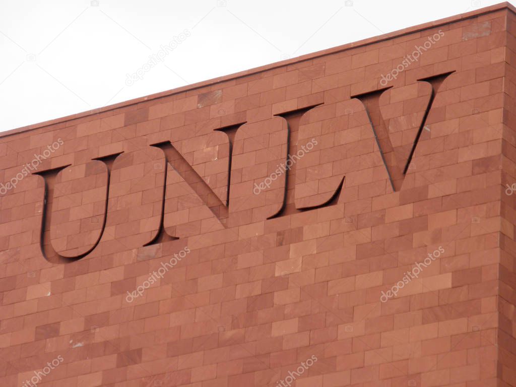 Las Vegas -  February 5, 2010:  UNLV Logo on side of Red Brick building. The University of Nevada, Las Vegas is a public research university in the Las Vegas suburb of Paradise, Nevada. The 332-acre campus is about 1.6 mi east of the Las Vegas Strip.
