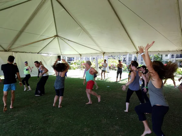 People dance outdoor under a tent during Ecstatic meditation dan — Stock Photo, Image