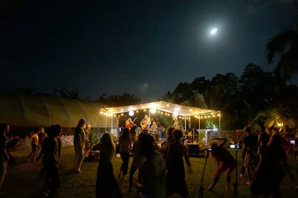 Rock band Roxotica playing under covered light up stage — Stock Photo, Image