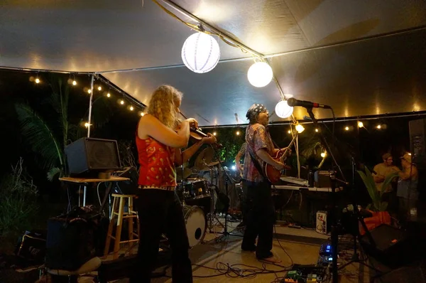 Rock band Roxotica playing under covered light stage — Stock Photo, Image