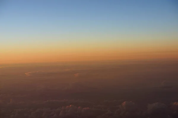 Aerial of Sunrise light over the world full of clouds — Stock Photo, Image