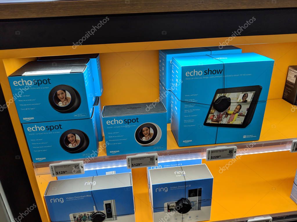 Honolulu - March 16, 2019: Echo Spot and Echo Show (2nd Generation) - Smart speaker with Alexa and with Ring Video Doorbell on display inside Best Buy store . Similarly to other devices in the family, it is designed around Amazon's virtual assistant