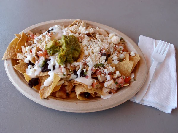 Chicken Nachos on paper plate — Stock Photo, Image