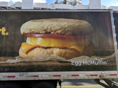 Honolulu - May 24, 2019: Egg McMuffin ad on the side of McDonalds Truck on Oahu, Hawaii clipart