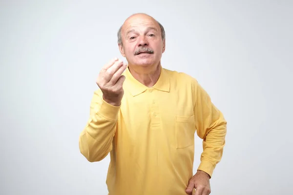 Portrait Mature Handsome Man Yellow Shirt Showing Italian Gesture Means — Stock Photo, Image