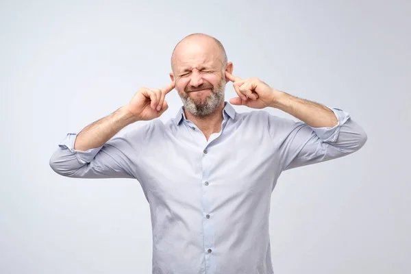 Annoyed Mature Man Plugging Ears Fingers Want Hear Gossips — Stock Photo, Image