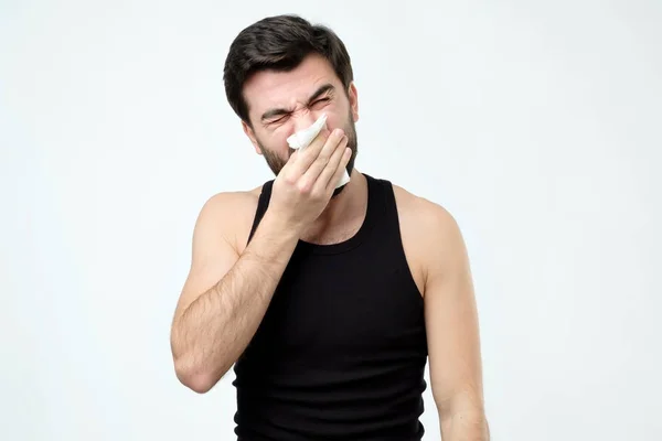 Man has running nose, rubs nose with handkerchief, being ill, caught cold — Stock Photo, Image