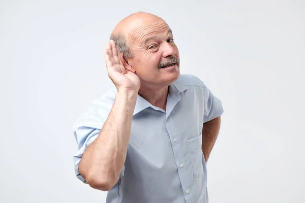 Studio Shot Of Senior Man Suffering From Deafness — Stock Photo, Image