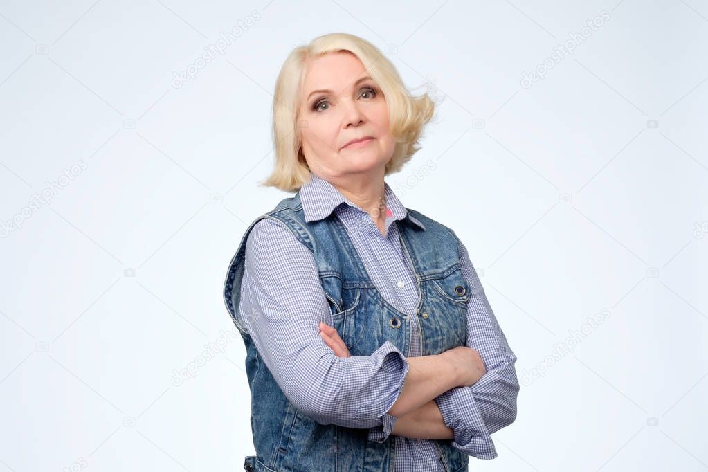 Senior blonde european woman with arrogant emotions.