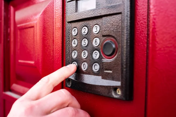 Man hand presses a button doorbell or intercom — Stock Photo, Image