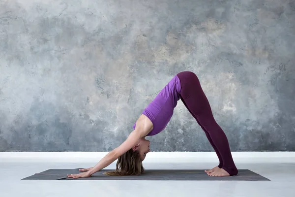 Woman doing yoga Legs Up or Viparita Karani variation yoga pose, Stock  image