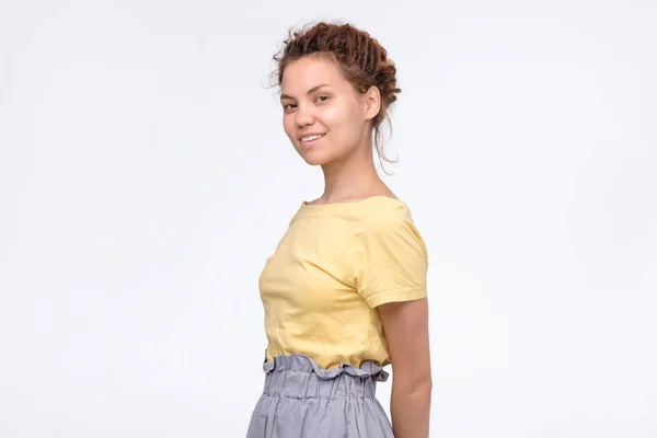 Cheerful ethnic girl in yellow t-shirt smiling confident — Stock Photo, Image