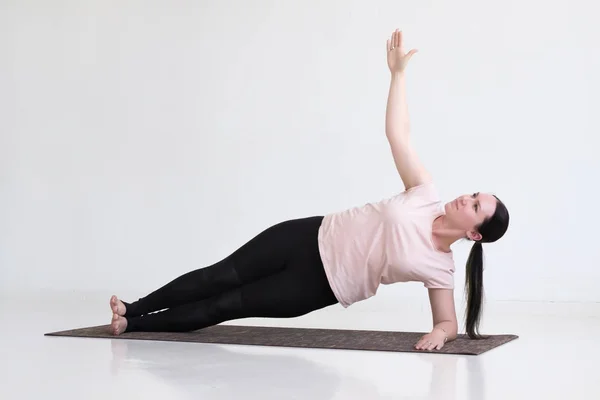 Woman doing exercises, Side Plank Pose, Vasisthasana, Yoga Pose