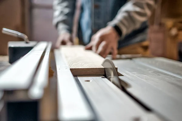 Man making wooden parts for furniture on thickness planer machine. — Stock Photo, Image
