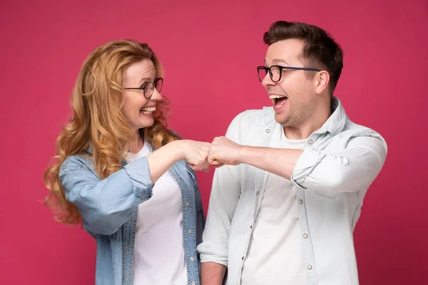 Caucaisan woman and man, friends or coworkers bumping fist — Stock Photo, Image