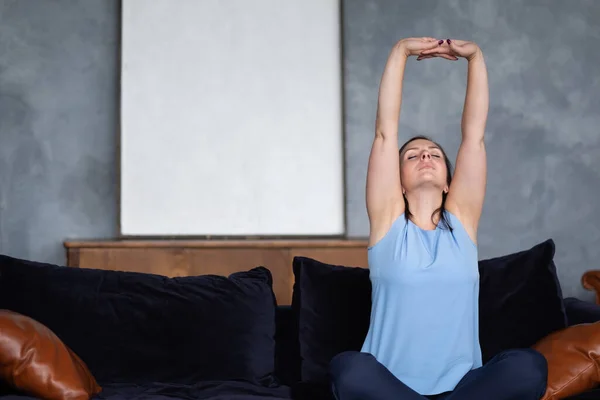 Woman relaxing on soft comfortable sofa meditating or having daytime nap — Stock Photo, Image