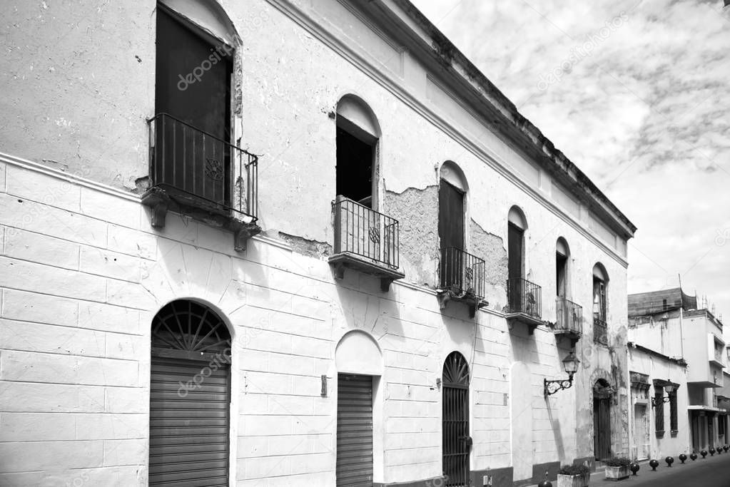 Reportage photos of building facades on the streets of Santo Domingo the capital of Dominican Republic. Buildings are situated in colonial zone of old city.