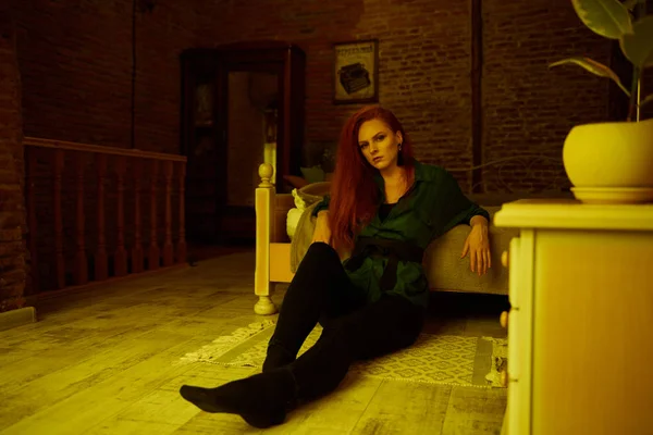 Vintage photo of Beautiful red haired young woman posing in old loft apartment in Tbilisi — Stock Photo, Image