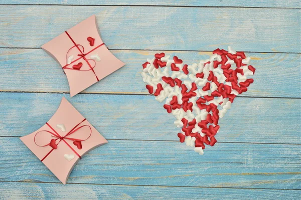 Beautiful valentines day paper hearts on blue wooden background. romantic background greeting card, box, strips and hearts. space for text