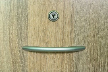 Brown wooden cabinet drawer with one keyhole clipart