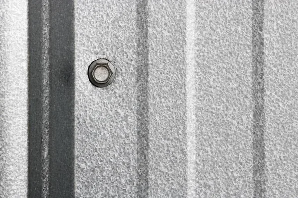 Texture of fitting bolt on wall metal sheet, abstract backgroun