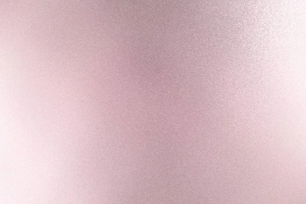 Texture of reflection on rough pink metallic wall, abstract background