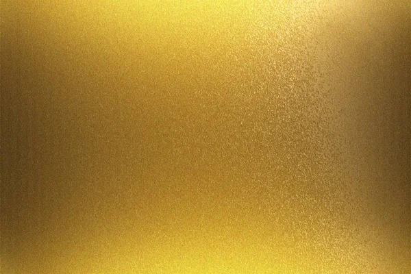 Light shining on golden foil metal wall, abstract texture background
