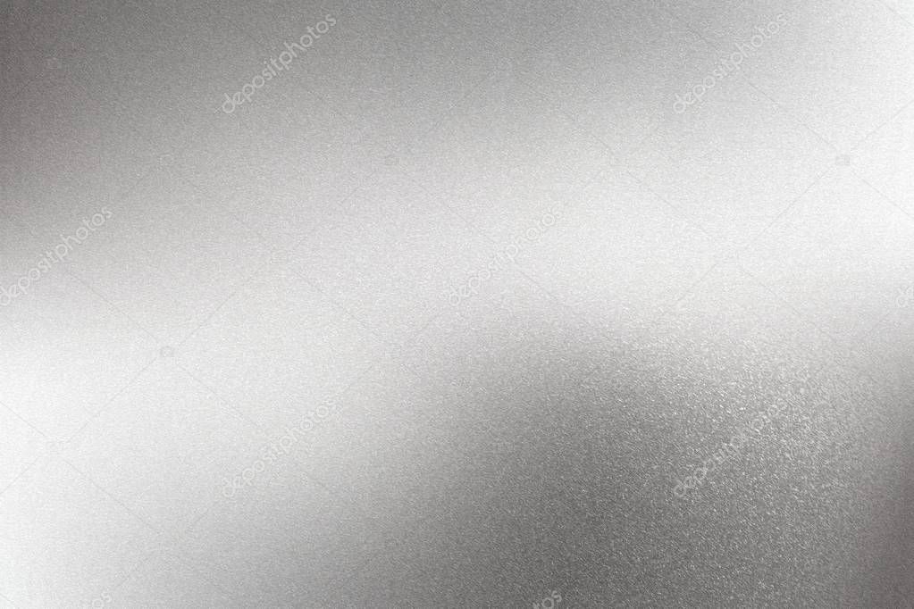 Glowing brushed silver steel wall surface, abstract texture background