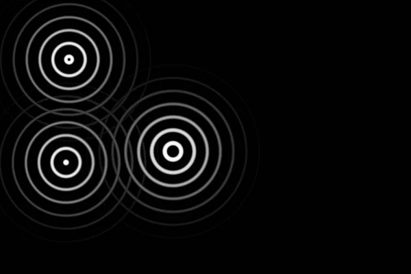 黑色背景上带环线的抽象白色圆圈 — 图库照片