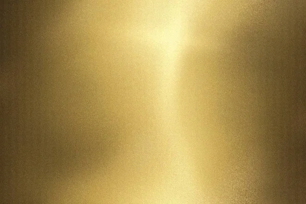 Light shining on gold wave metal panel, abstract texture background